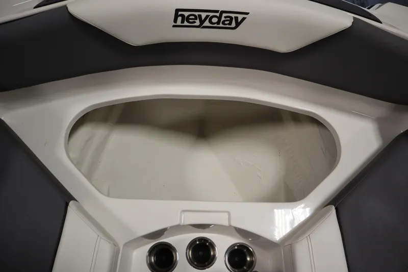 Slide: The Image of 2023 Heyday WT Surf boat interior storage compartment with cup holders. - 15