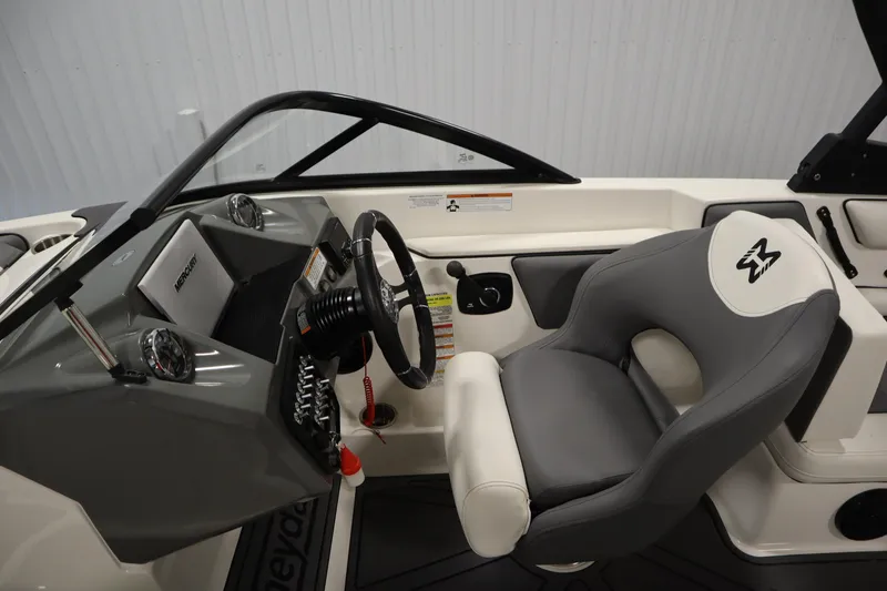 Slide: The Image of 2023 Heyday WT Surf boat interior with steering wheel and comfortable seating. - 18