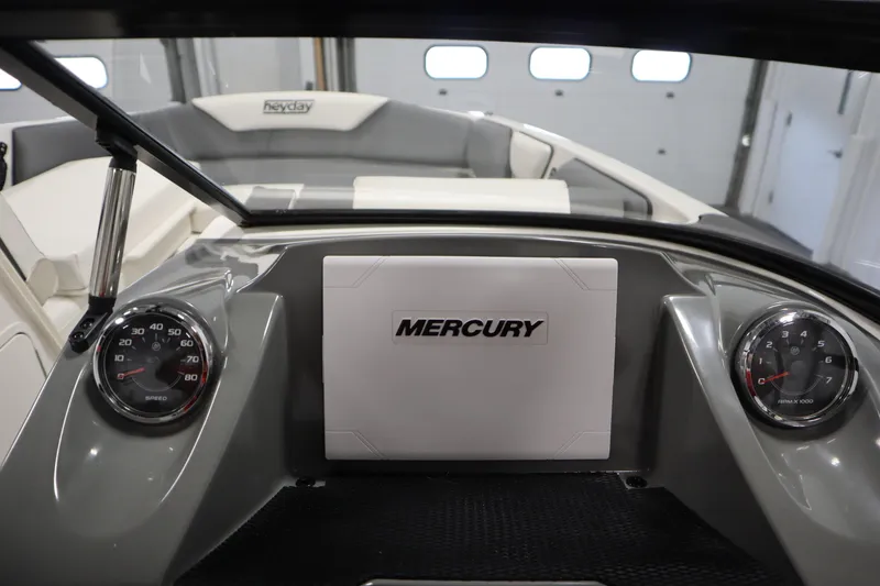 Slide: The Image of 2023 Heyday WT Surf boat dashboard with Mercury controls and gauges. - 21