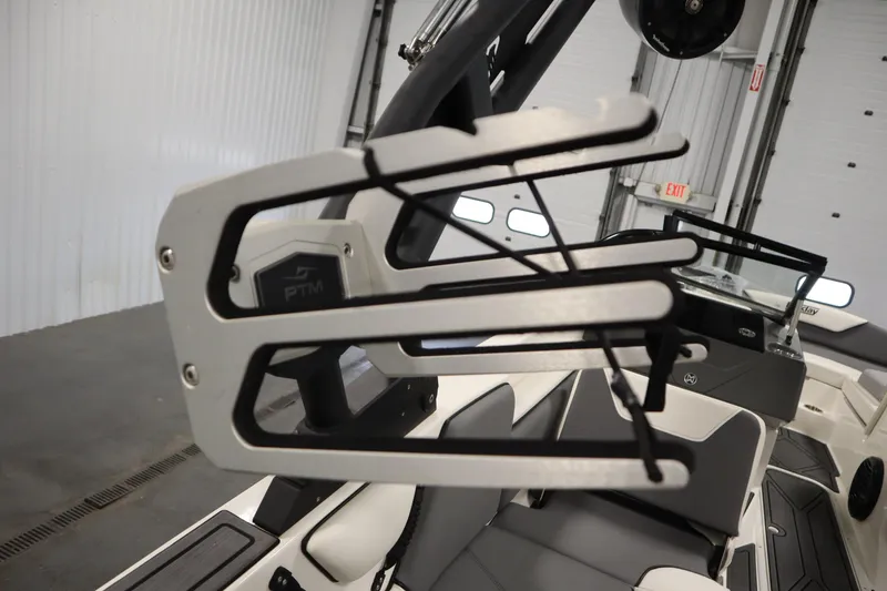 Slide: The Image of 2023 Heyday WT Surf boat interior with wakeboard rack and seating. - 46