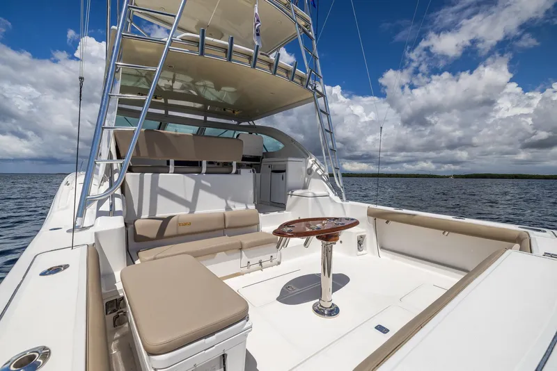 Slide: The Image of 2004 Tiara Yachts 4200 Open on calm waters with blue sky. - 11