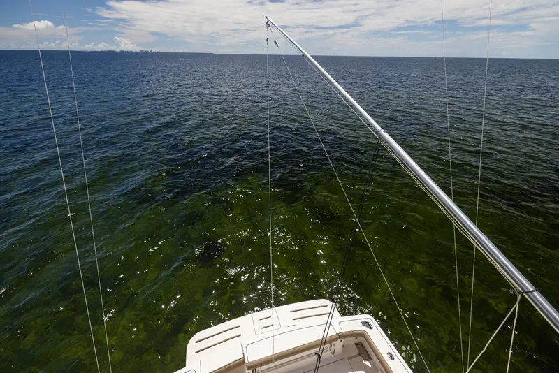 Slide: The Image of Tiara Yachts 4200 Open 2004 on open sea, fishing rods in use. - 21