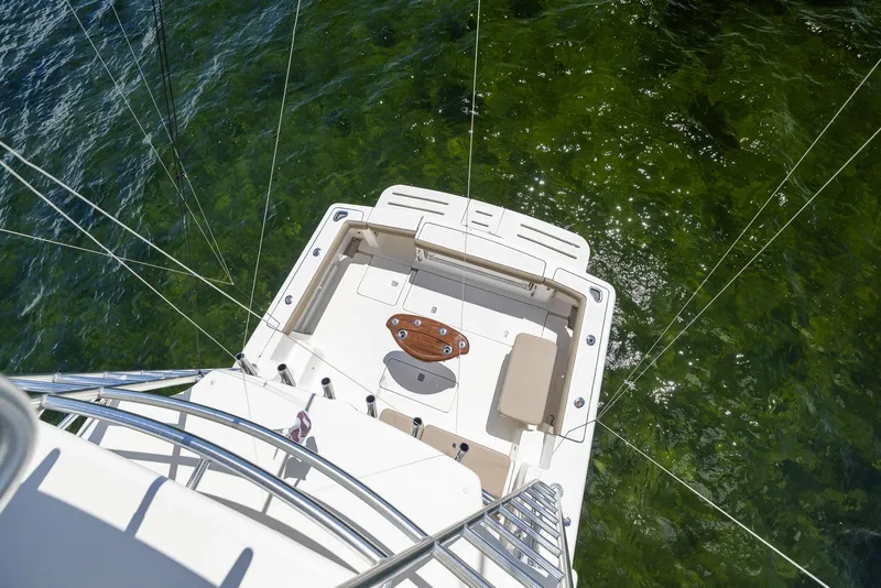 Slide: The Image of Aerial view of 2004 Tiara Yachts 4200 Open on green water. - 22