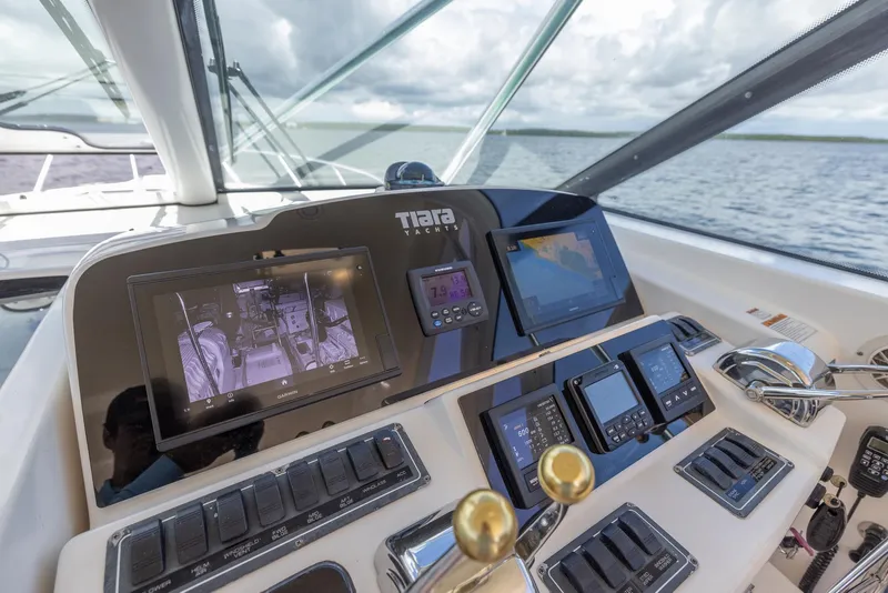 Slide: The Image of Tiara Yachts 4200 Open 2004 helm with modern navigation instruments. - 26