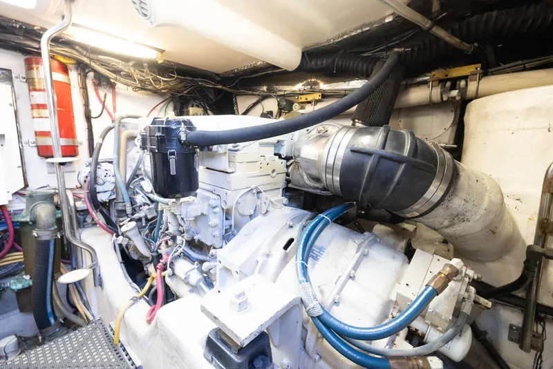 Slide: The Image of Engine room of 2004 Tiara Yachts 4200 Open with cables and hoses. - 36
