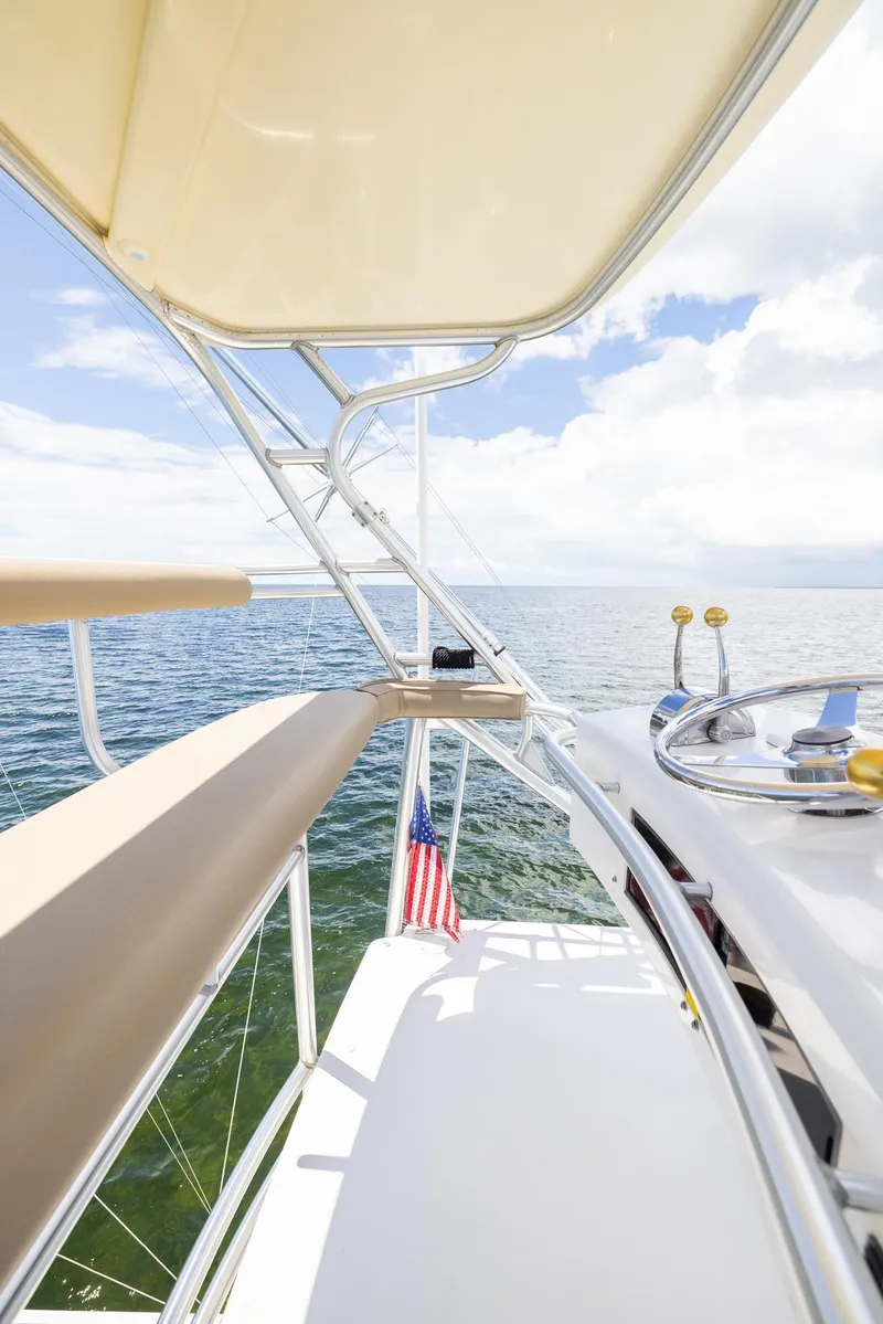 Slide: The Image of Tiara Yachts 4200 Open 2004 on open sea, helm view. - 40