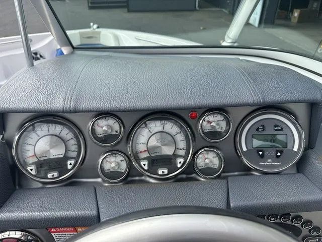 Slide: The Image of Dashboard of 2007 Nautique Super Air Nautique 210 boat with gauges and controls. - 11