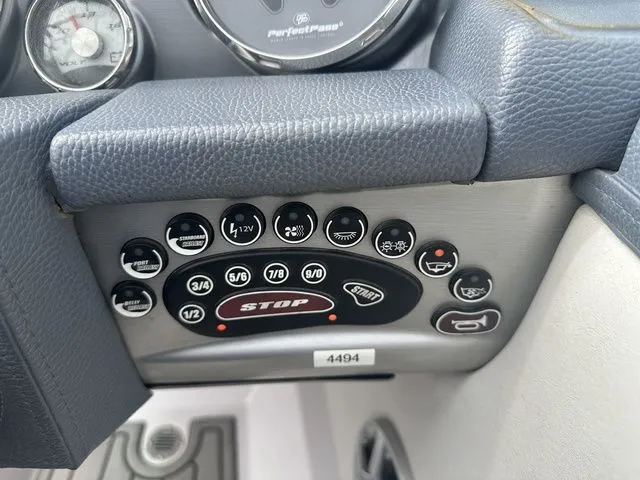 Slide: The Image of Control panel of a 2007 Nautique Super Air Nautique 210 boat. - 12