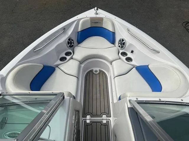 Slide: The Image of 2007 Nautique Super Air Nautique 210 boat interior with blue and white seating. - 15