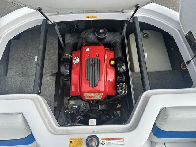 Slide: The Image of 2007 Nautique Super Air Nautique 210 engine compartment with red PCM engine. - 16