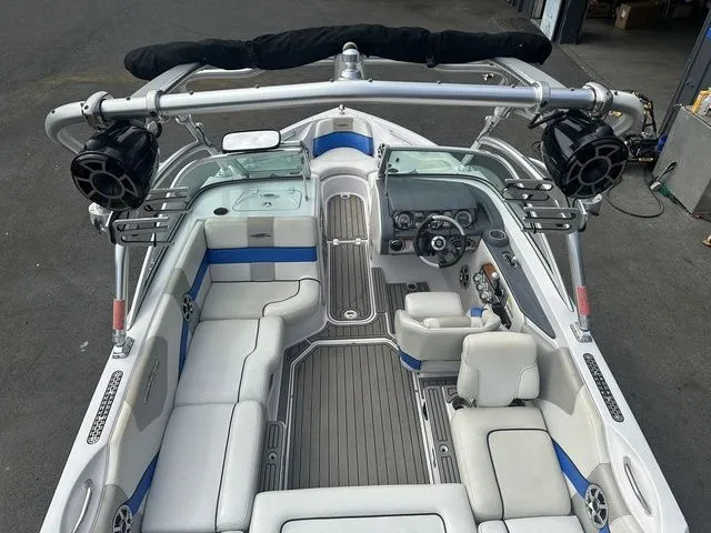 Slide: The Image of 2007 Nautique Super Air Nautique 210 boat interior with seating, speakers, and control panel. - 8