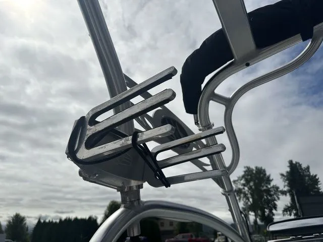 Slide: The Image of Wakeboard rack on 2007 Nautique Super Air Nautique 210 against cloudy sky. - 9