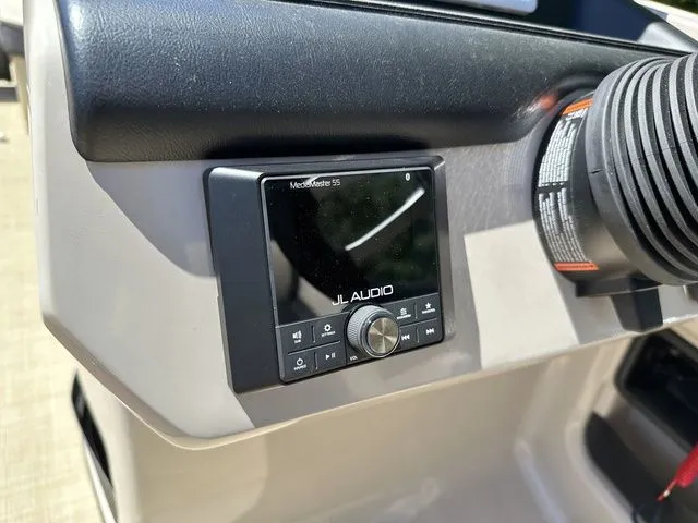 Slide: The Image of Control panel of 2025 Harris Cruiser 210 CWDH with JL Audio system. - 27