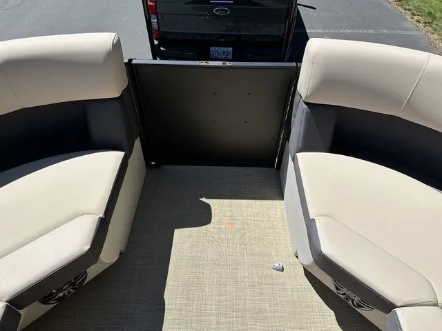 Slide: The Image of Interior view of 2025 Harris Cruiser 210 CWDH pontoon boat with beige seating. - 36