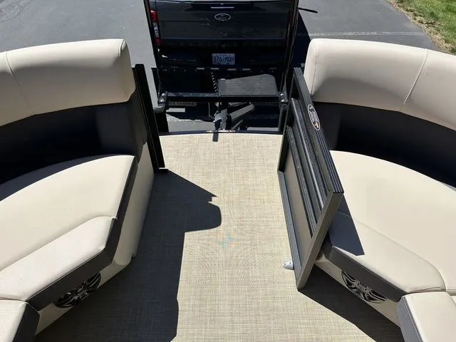 Slide: The Image of 2025 Harris Cruiser 210 CWDH pontoon boat interior with beige seating and open gate. - 37