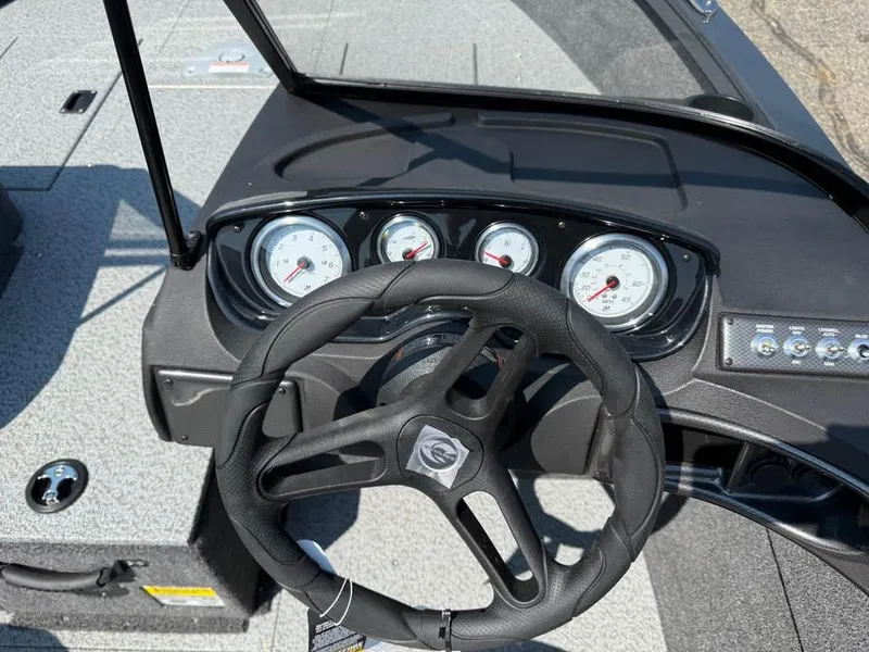 Slide: The Image of Dashboard of 2026 Crestliner 1750 Fish Hawk WT JS boat with steering wheel and gauges. - 10