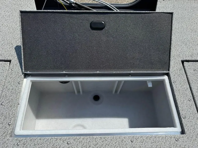 Slide: The Image of Open storage compartment in 2026 Crestliner 1750 Fish Hawk WT JS boat. - 13