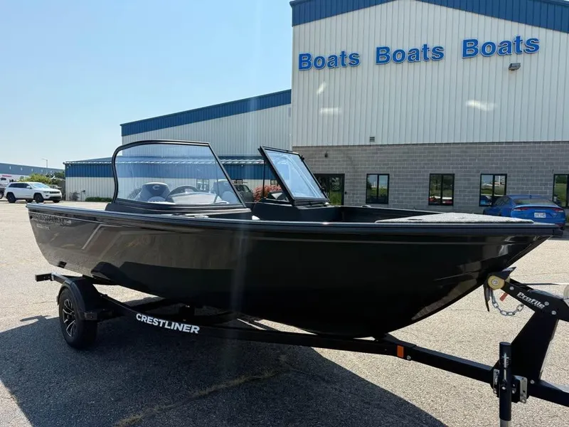 Slide: The Image of 2026 Crestliner 1750 Fish Hawk WT JS boat on trailer outside dealership. - 2