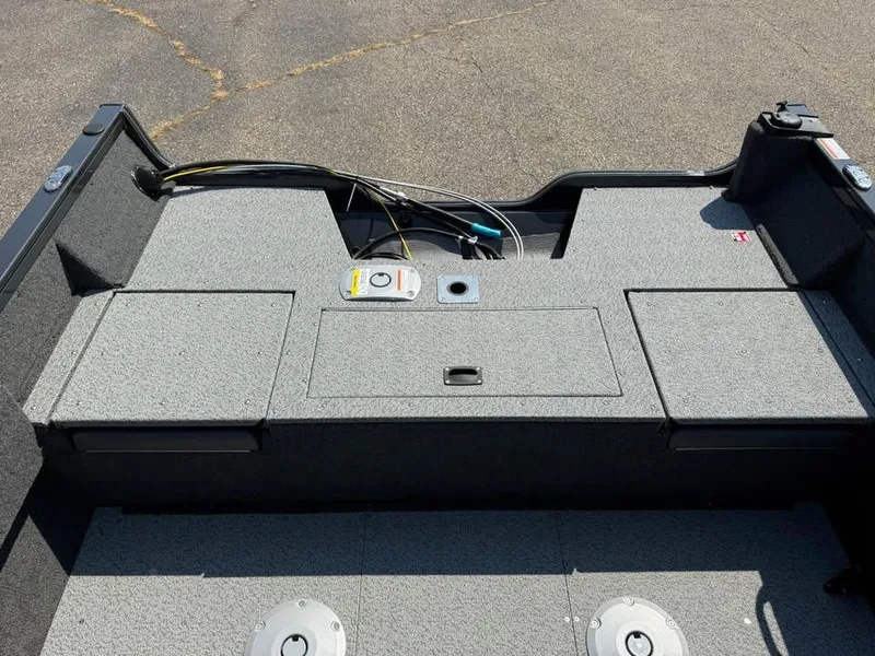 Slide: The Image of 2026 Crestliner 1750 Fish Hawk WT JS boat interior with storage compartments. - 7