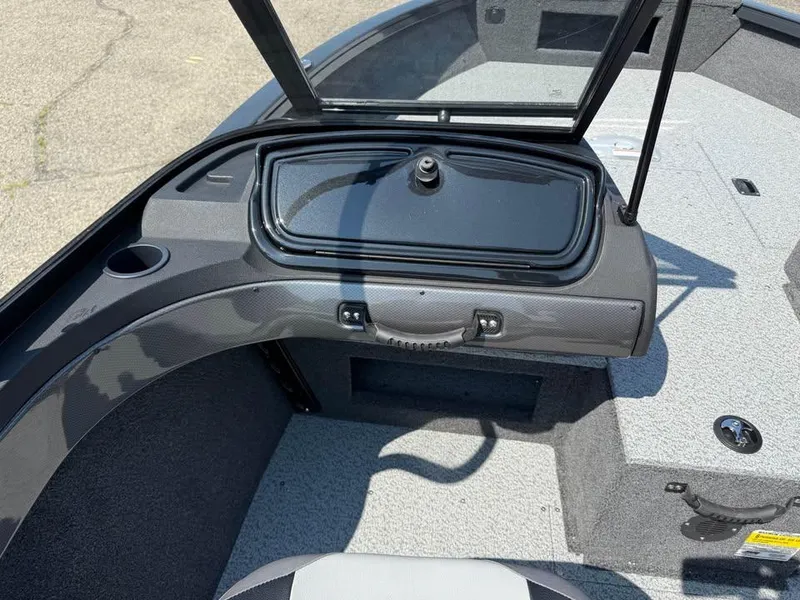 Slide: The Image of 2026 Crestliner 1750 Fish Hawk WT JS boat interior with open storage compartment. - 9