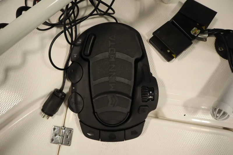 Slide: The Image of Minn Kota foot pedal on 2022 Robalo 246 Cayman boat deck. - 14