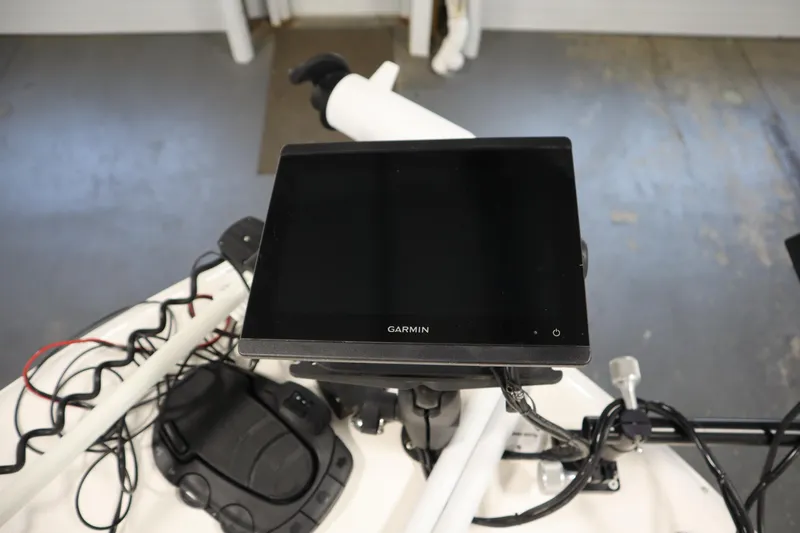 Slide: The Image of Garmin display on 2022 Robalo 246 Cayman boat dashboard, featuring navigation equipment. - 19