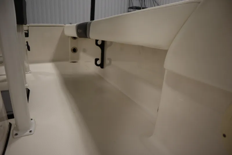 Slide: The Image of Interior view of 2022 Robalo 246 Cayman boat, showcasing seating and storage area. - 32