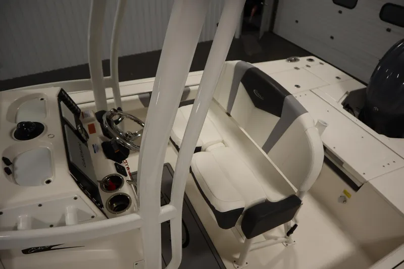 Slide: The Image of 2022 Robalo 246 Cayman boat interior with steering console and seating. - 33