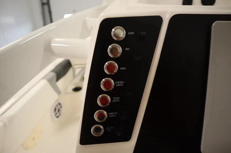 Slide: The Image of Control panel of 2022 Robalo 246 Cayman boat with labeled switches. - 37