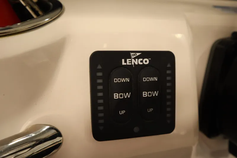 Slide: The Image of Lenco trim tab control panel on 2022 Robalo 246 Cayman boat. - 44