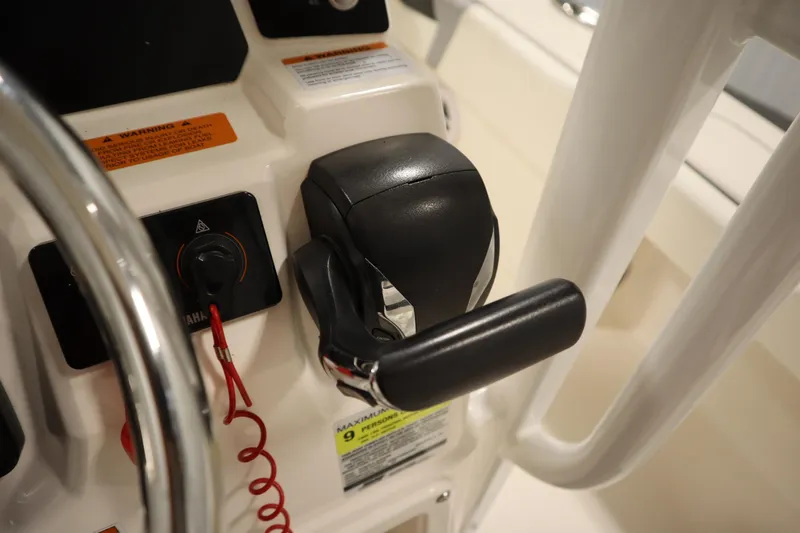 Slide: The Image of 2022 Robalo 246 Cayman boat throttle and control panel close-up. - 45