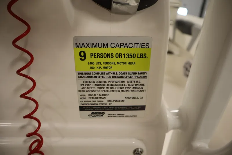 Slide: The Image of Capacity label on 2022 Robalo 246 Cayman boat, max 9 persons or 1350 lbs. - 46
