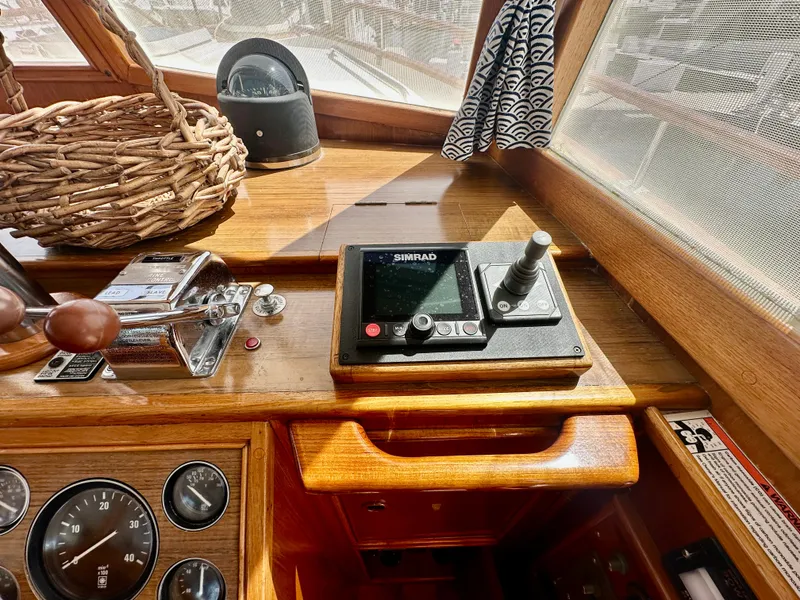 Slide: The Image of Control panel of a 1989 Grand Banks 42 Classic yacht with navigation equipment. - 11