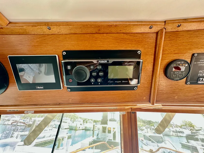 Slide: The Image of Control panel of a 1989 Grand Banks 42 Classic yacht with electronic displays. - 13