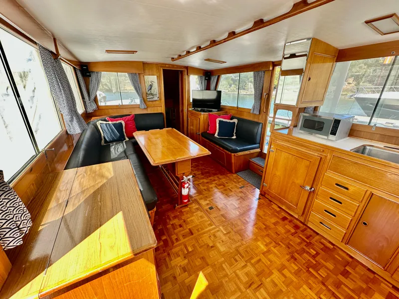 Slide: The Image of Interior of 1989 Grand Banks 42 Classic yacht with wood finish and cozy seating area. - 18