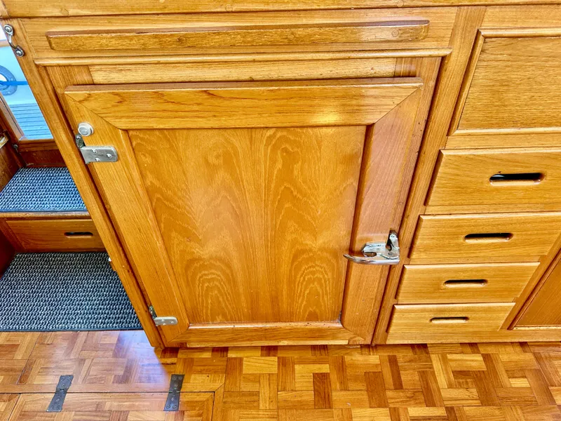 Slide: The Image of Wooden cabinetry on a 1989 Grand Banks 42 Classic yacht interior. - 21