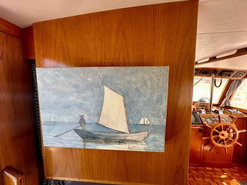 Slide: The Image of Painting of a sailboat on a wooden wall inside a 1989 Grand Banks 42 Classic yacht. - 33