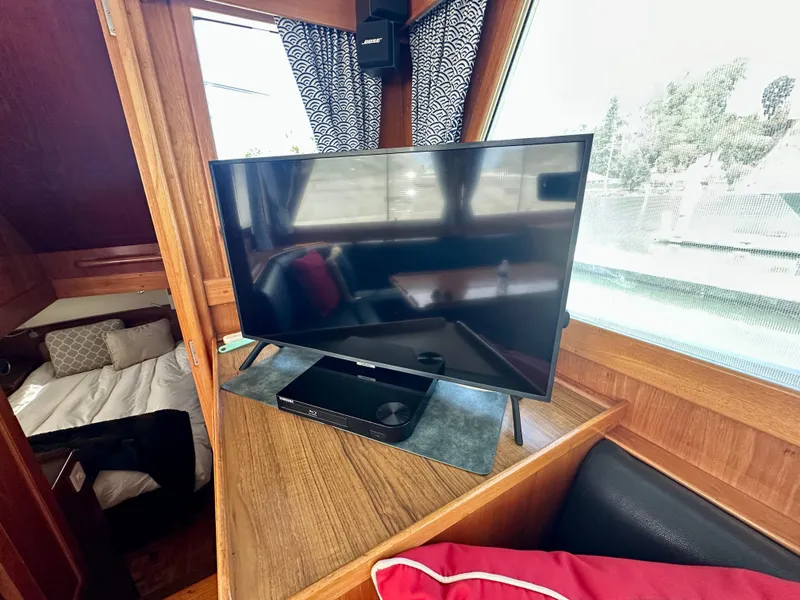 Slide: The Image of Interior of 1989 Grand Banks 42 Classic yacht with TV and cozy cabin. - 35