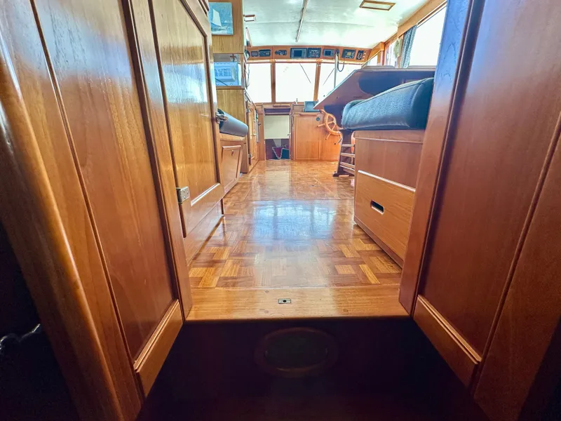 Slide: The Image of Interior view of 1989 Grand Banks 42 Classic yacht with wooden flooring and seating. - 36