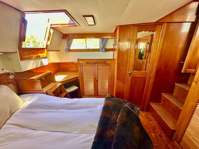 Slide: The Image of Cozy cabin interior of 1989 Grand Banks 42 Classic with wooden furnishings and natural light. - 40