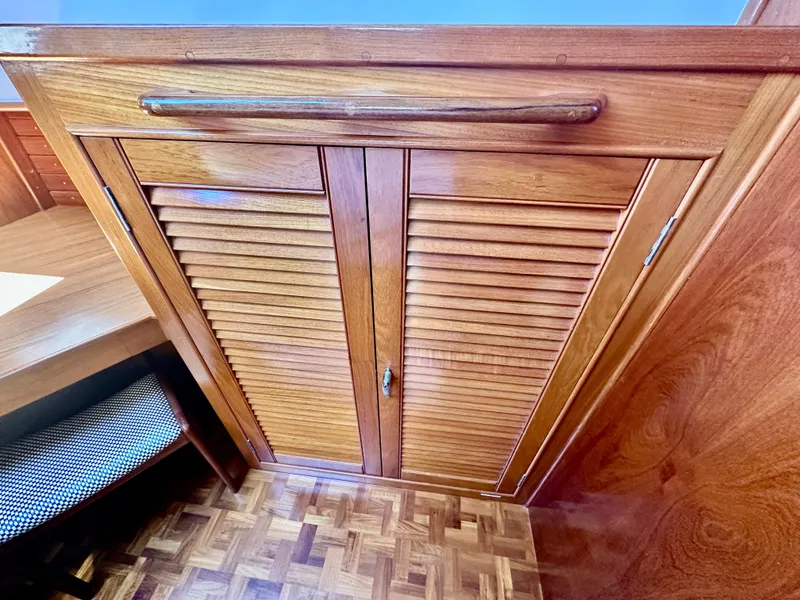 Slide: The Image of Wooden cabinet doors on 1989 Grand Banks 42 Classic yacht interior. - 45