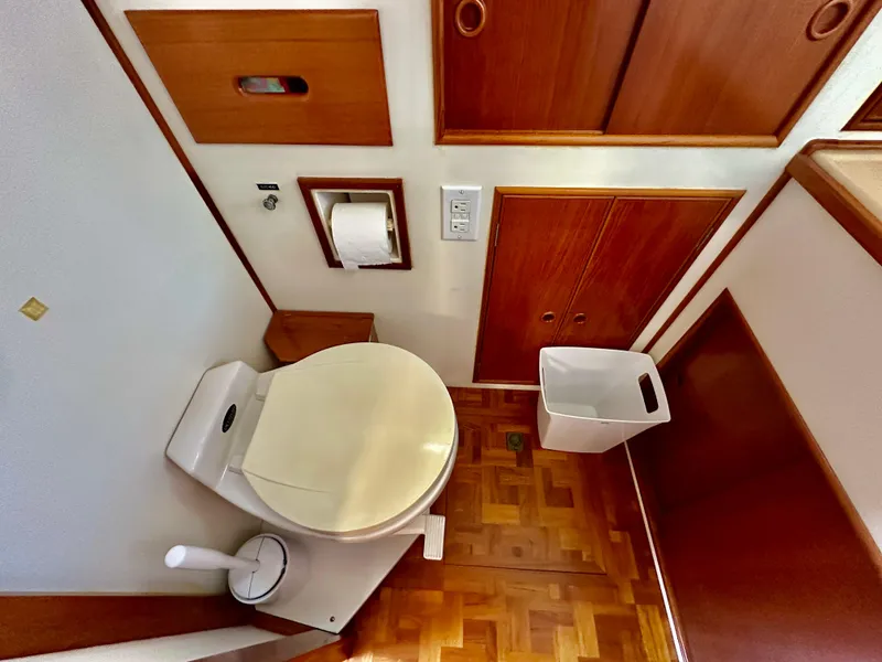 Slide: The Image of Bathroom interior of 1989 Grand Banks 42 Classic yacht with wooden cabinetry and parquet flooring. - 47