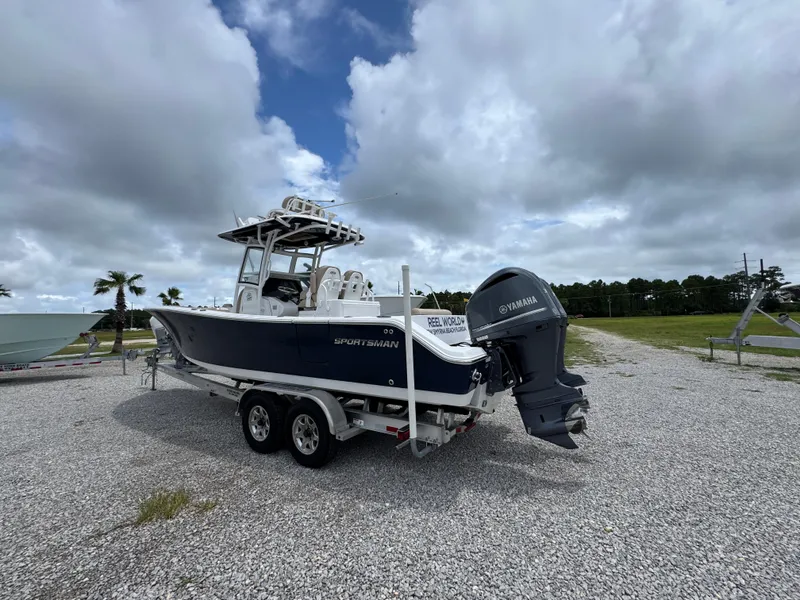 Slide: The Image of 2020 Sportsman Open 282TE Center Console boat on trailer, cloudy sky background. - 12