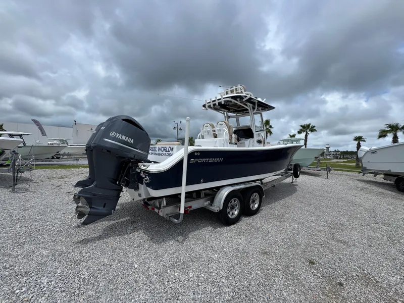 Slide: The Image of 2020 Sportsman Open 282TE Center Console boat on trailer, cloudy sky background. - 16