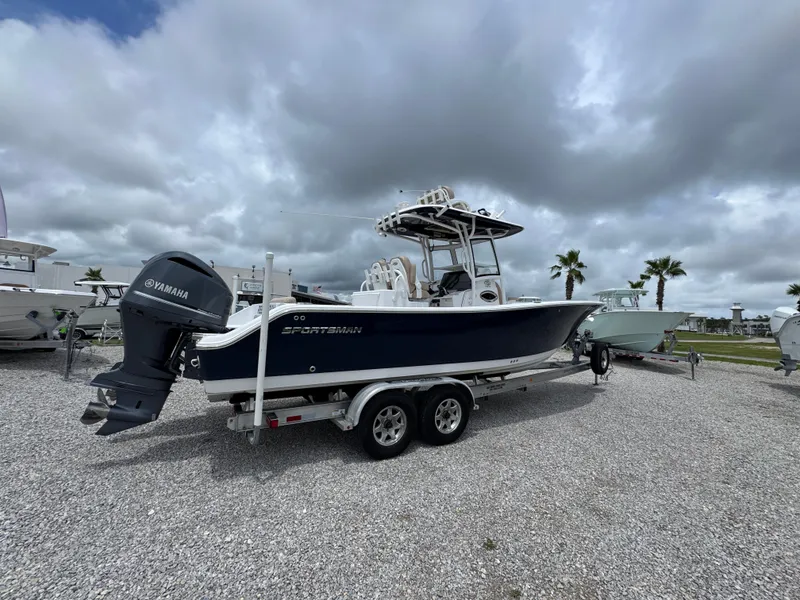 Slide: The Image of 2020 Sportsman Open 282TE Center Console boat on trailer, cloudy sky background. - 17