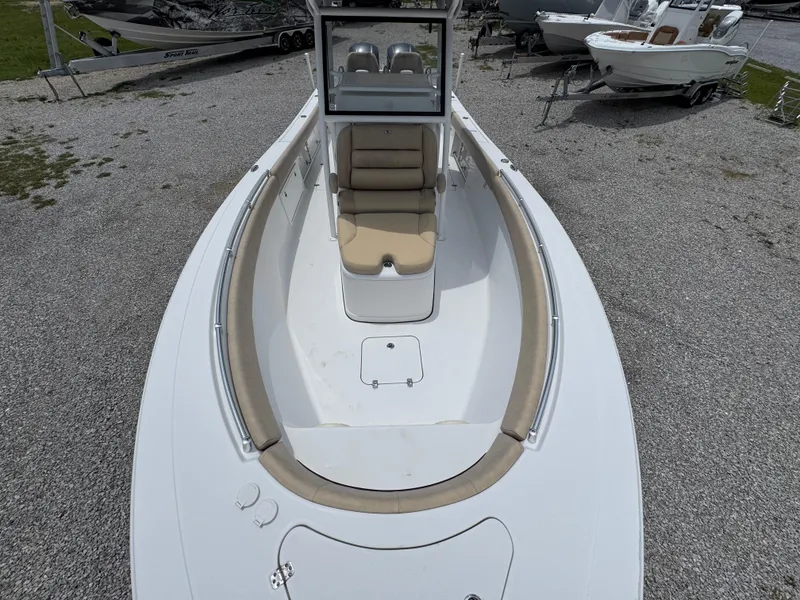 Slide: The Image of 2020 Sportsman Open 282TE Center Console boat with cushioned seating and spacious deck. - 21