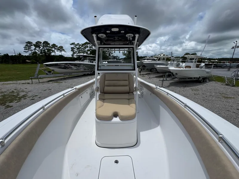 Slide: The Image of 2020 Sportsman Open 282TE Center Console boat on display under cloudy skies. - 23