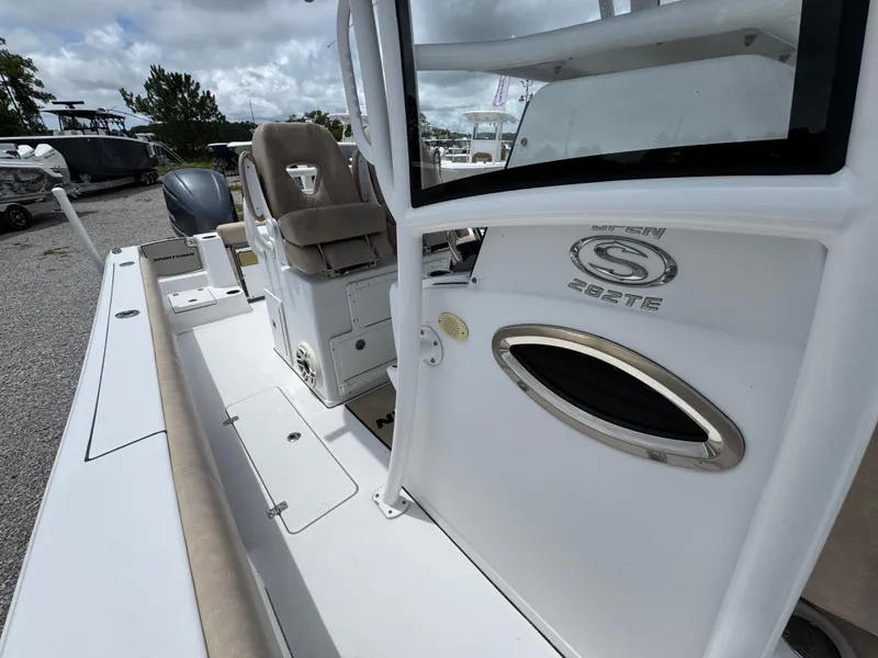 Slide: The Image of 2020 Sportsman Open 282TE Center Console boat, featuring seating and console details. - 26