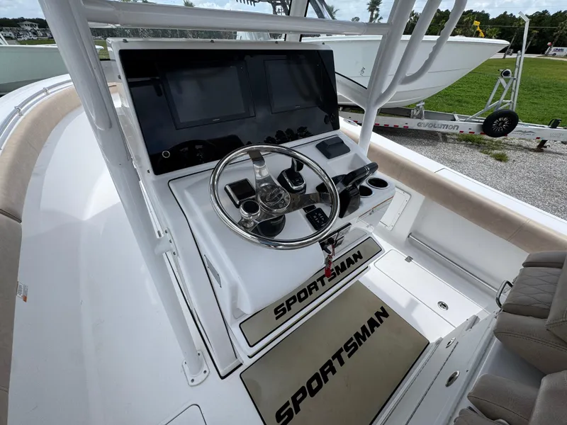Slide: The Image of 2020 Sportsman Open 282TE Center Console helm with dual screens and steering wheel. - 29
