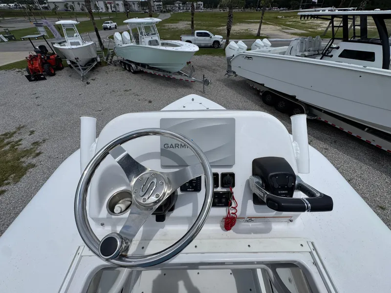 Slide: The Image of 2020 Sportsman Open 282TE Center Console boat helm with Garmin navigation system. - 34